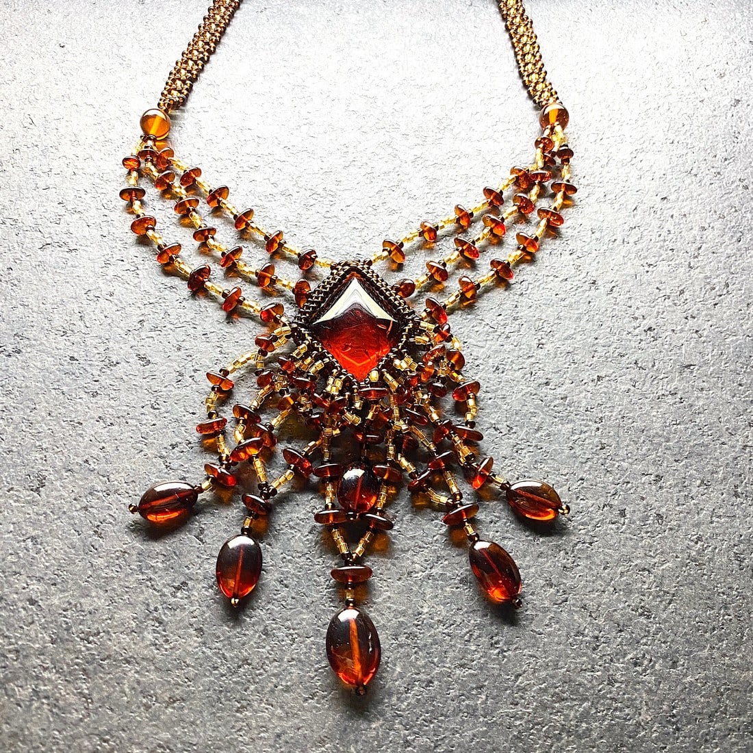 Phenomenal Amber Floral Necklace made from leaf like bead ornaments: Title:Phenomenal Amber Floral Necklace made from leaf like bead ornaments Metal:NoneGemstone:AmberWeight:23.3 gSize:Size: 480.0 x 90.0 x 10.0 mm Size: 18.898 x 3.543 x 0.394 inches Made