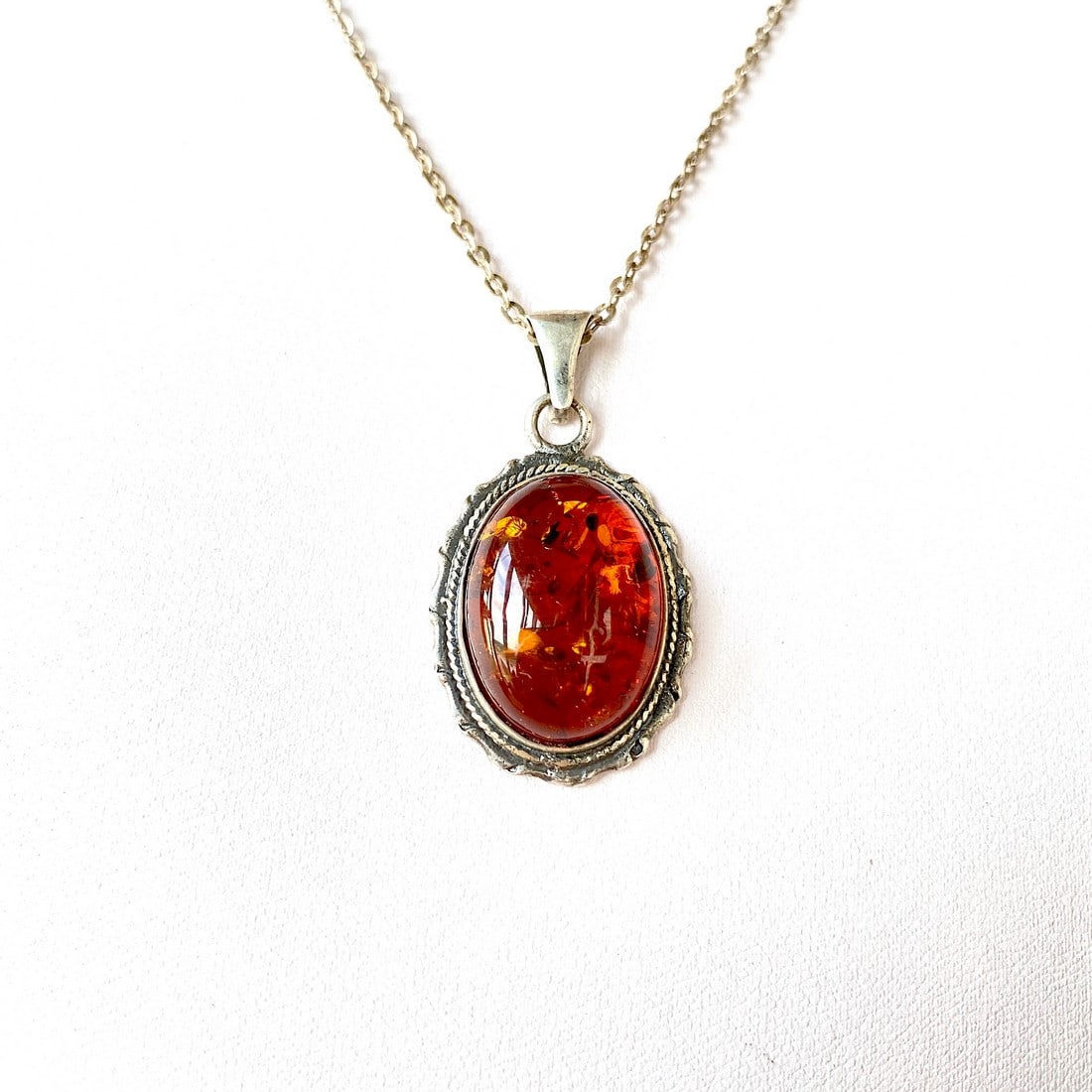 Antique Amber Pendant: Title:Antique Amber Pendant Metal:Silver 875 Gemstone:Amber Weight:9.7 g Size:Size: 30.0 x 23.0 x 9.27 mm Size: 1.181 x 0.906 x 0.365 inches Made of:(Reconstituted Amber or Whole Stone):Whole Stone Ad