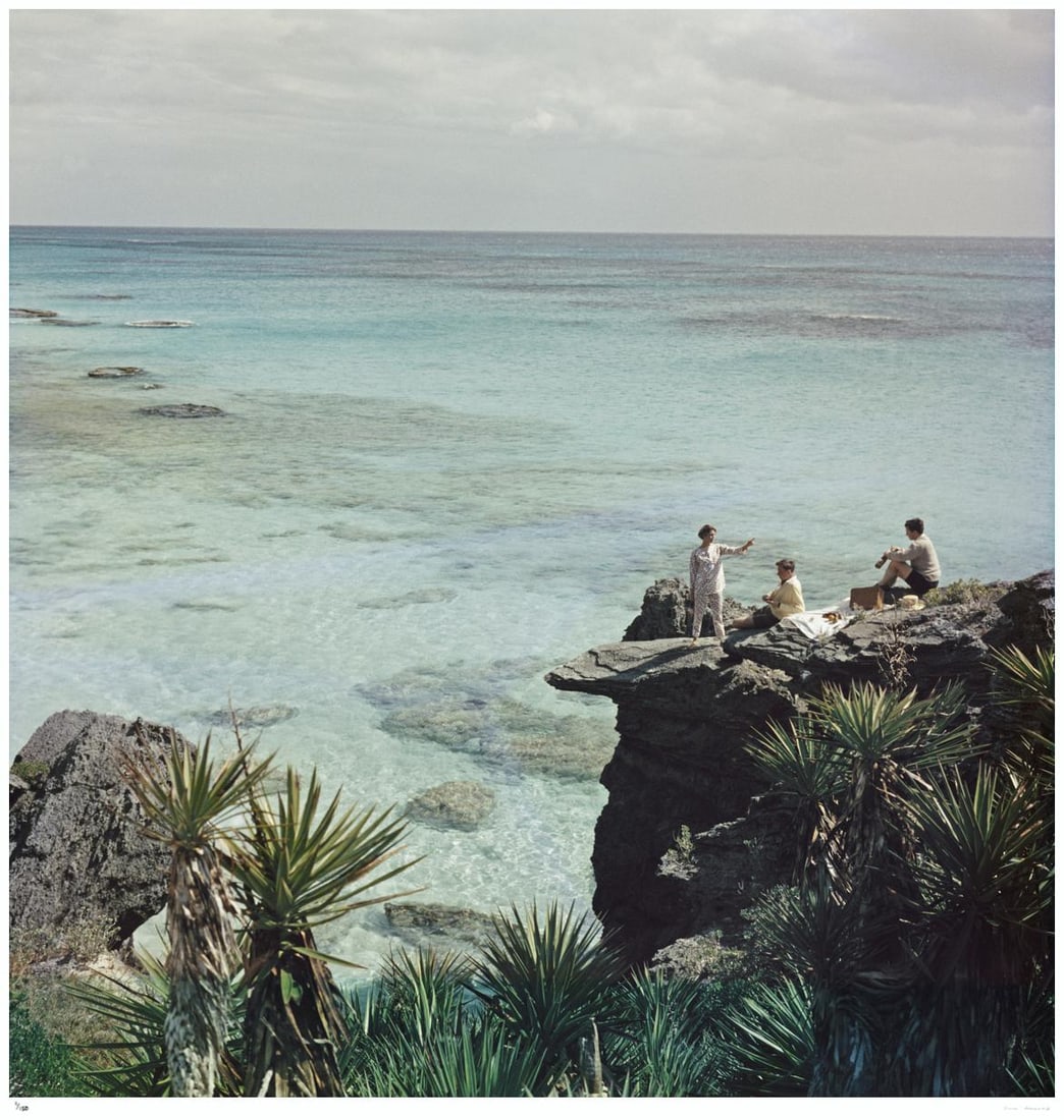 A Nice Spot For Lunch 1957 - Slim Aarons Estate Stamped: 1957 (printed later): Title: A Nice Spot For Lunch 1957 - Slim Aarons Estate Stamped: 1957 (printed later) Description: A Nice Spot For Lunch 1957 - Slim Aarons Estate Stamped A group enjoy a picnic at a rocky coastline