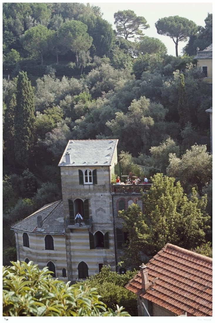 Portofino, Italy 1985 - Slim Aarons Estate Stamped: 1985 (printed later): Title: Portofino, Italy 1985 - Slim Aarons Estate Stamped: 1985 (printed later) Description: Portofino, Italy 1985 - Slim Aarons Estate Stamped Guests relax on the terrace at the villa of Umberto and