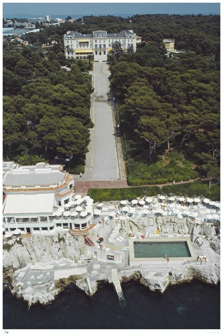 Hotel du Cap-Eden-Roc 1976- Slim Aarons Estate Stamped: 1976 (printed later): Title: Hotel du Cap-Eden-Roc 1976- Slim Aarons Estate Stamped: 1976 (printed later) Description: Hotel du Cap-Eden-Roc 1976- Slim Aarons Estate Stamped An aerial view of the Hotel du Cap-Eden-Roc in