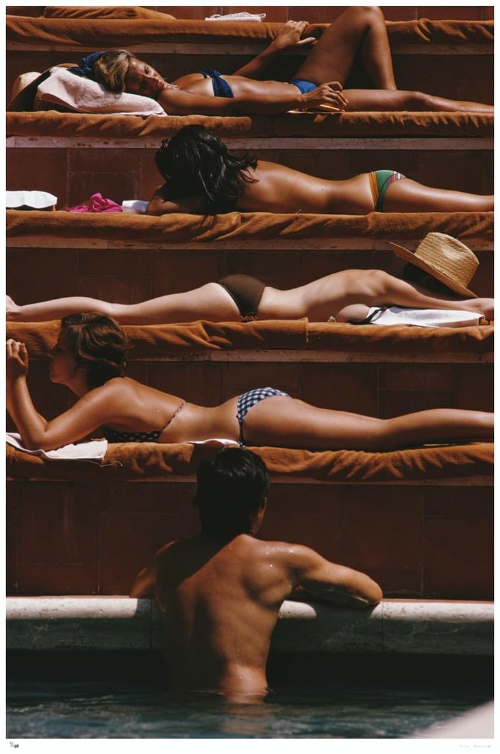 Eye Of The Beholder 1974 - Slim Aarons Estate Stamped: 1974 (printed later): Title: Eye Of The Beholder 1974 - Slim Aarons Estate Stamped: 1974 (printed later) Description: Eye Of The Beholder 1974 - Slim Aarons Estate Stamped A man contemplates the sunbathers by a swimming