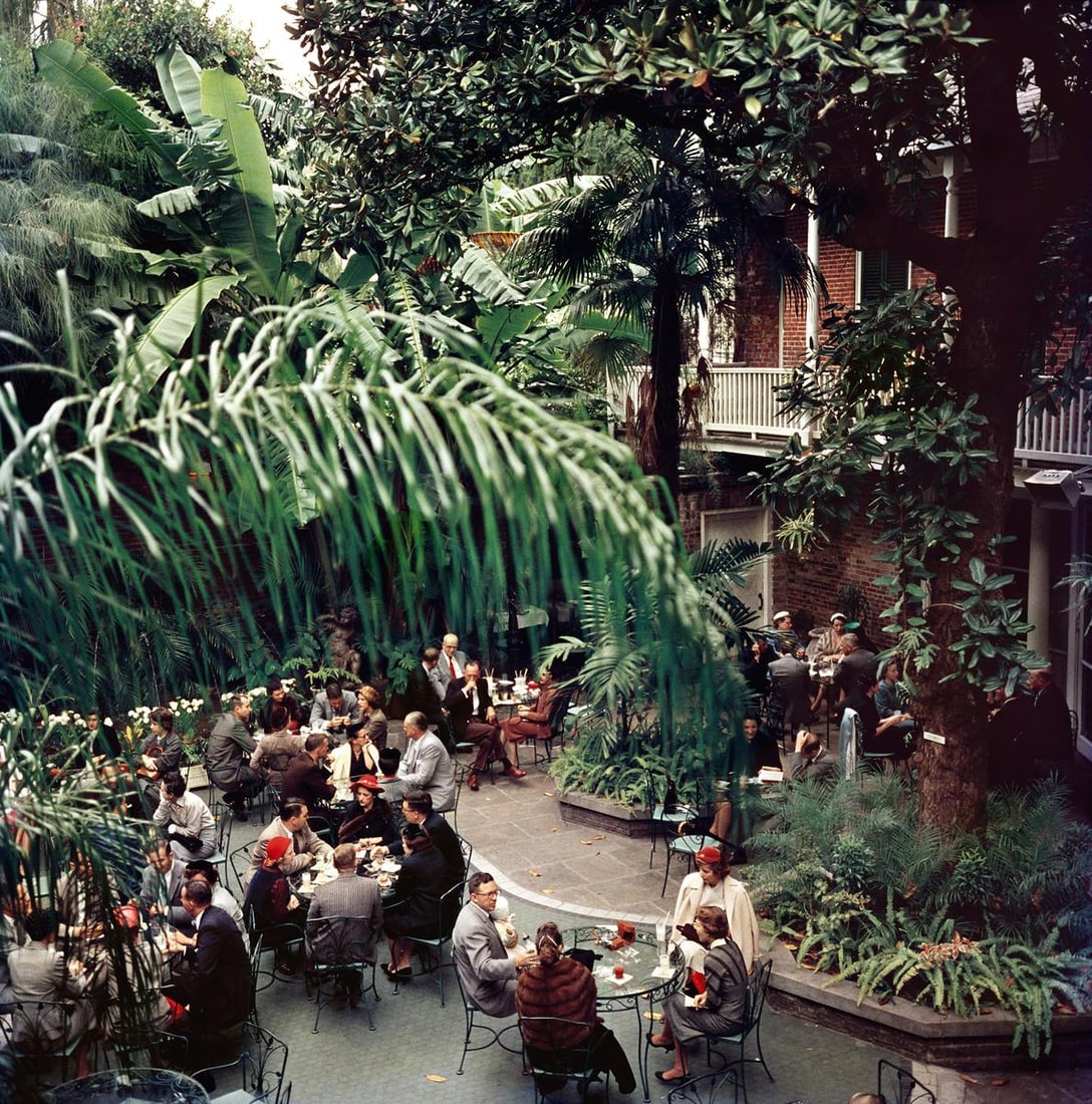 Slim Aarons 'Brunch At Brennans' 1960 Limited Estate Edition: 1960 (printed later): Title: Slim Aarons 'Brunch At Brennans' 1960 Limited Estate Edition: 1960 (printed later) Description: Brunch At Brennans' c. 1960. Sunday brunch at Brennan’s restaurant, New Orleans. 40x40"