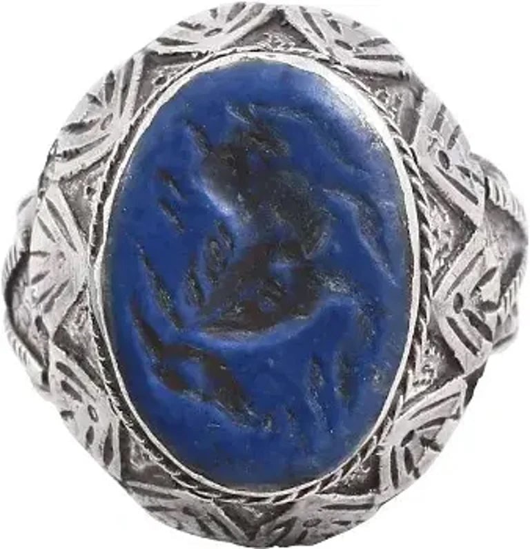 EASTERN EUROPEAN GYPSY CLAN LEADER'S RING: 19th century. Size 8 1/2. White metal possibly silver. Broad 4.2mm band flaring to the shoulders and chiseled in angled motif on scale ground. Broad-angled bezel chiseled in triangles below a roped