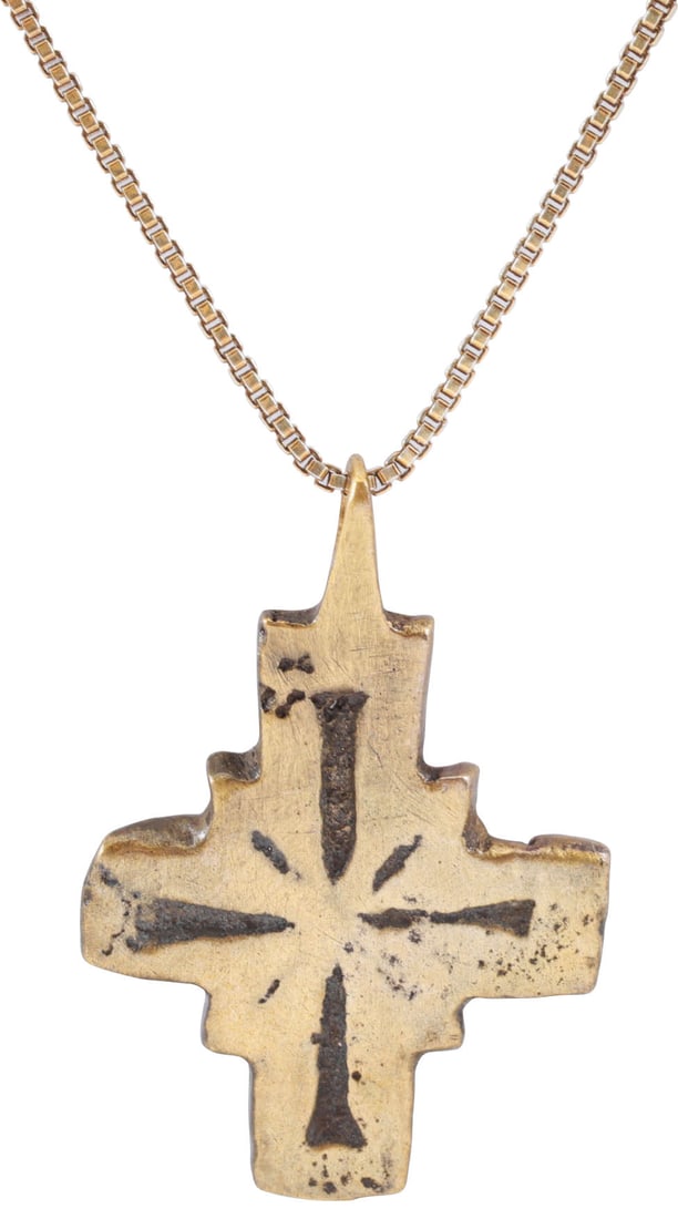 EUROPEAN PILGRIM'S OR CRUSADER'S CROSS, 8TH-12TH CENTURY AD: About 1" (1.02”) total height. The crossbeam is centered with a square. The center with a semi-linear cross form and the square quarters with incised radials describing a saltire. Reverse