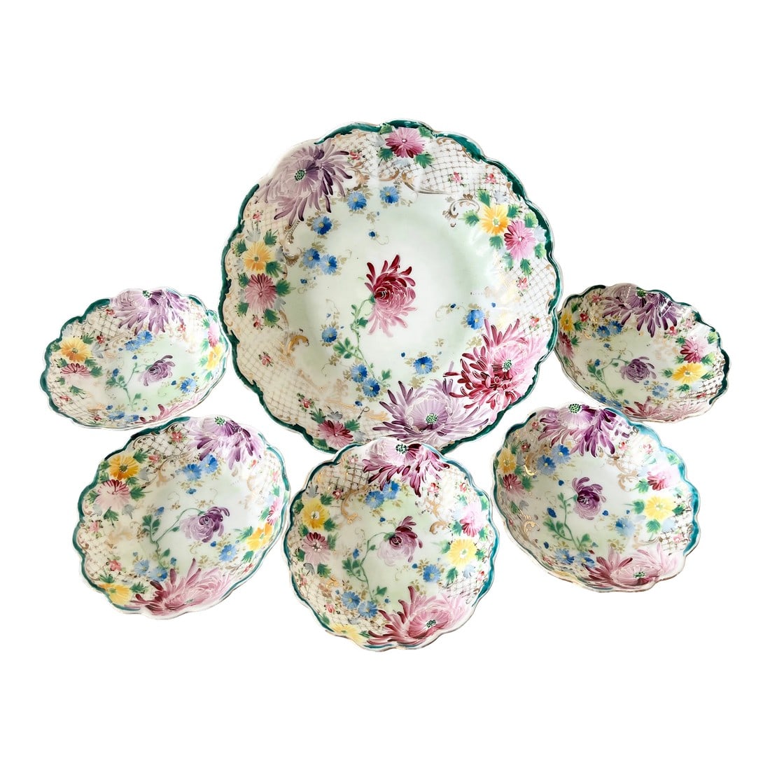 Early 20th Century European Hand-Painted Chrysanthemum Motif Porcelain Serving Bowl With 5 Dessert B: A set of antique hand-painted European porcelain bowls, early 20th century. The set includes a wide and shallow serving bowl and five dessert-size bowls, each painstakingly painted with a chrysanthemu