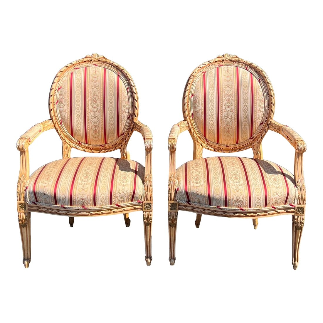 1960s Pair of Louis XVI Style Arm Chairs: A very fine pair of Louis XVI open arm side chairs adorned with a beautiful cream, gold & striped brocade fabric. Condition: Original Condition Unaltered; Some Imperfections; Superb pair of Louis XVI
