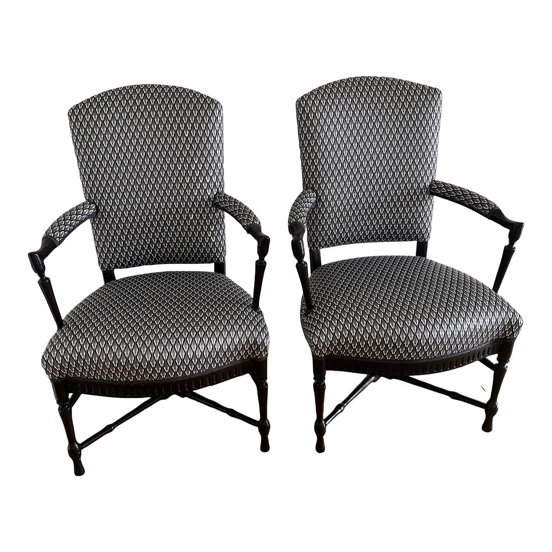 Pair of 1930s French Provincial Upholstered Armchairs: Pair of circa 1930's French provincial upholstered armchairs. Walnut wood with carved details and finial on the crossed stretchers. Newly upholstered in Dedar Serpentino fabric. Finish is dark ebonize