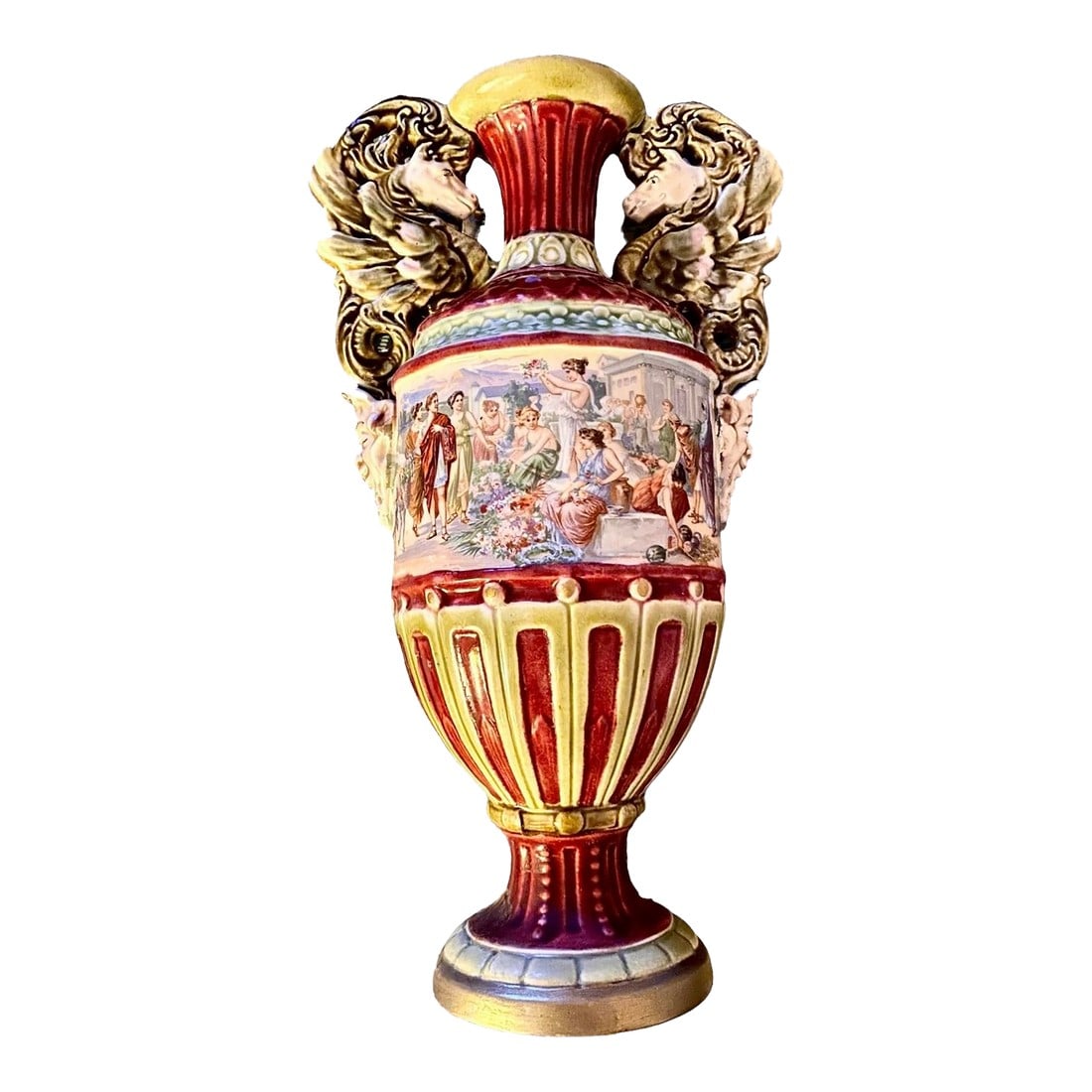 Antique 1920's Grand Tour Italian Venice Majolica: An antique, grand tour, Italian hand painted and transfer ware majolica handled vase with panels depicting Ancient Greek Society, handles in the shape of winged griffin's and grotesque masks mounted