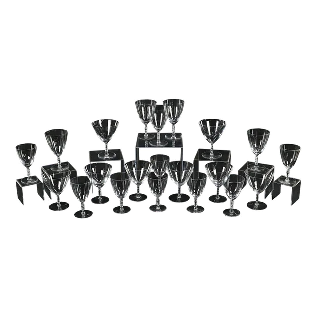 Circa 1926 Rene Lalique Guebwiller Stemware Set- 21 Pieces: 21 pieces signed Lalique crystal and frosted glass stemware in the Guebwiller pattern. Molded braided design to the stem. 8 Champagnes / sherbets, each 5"H; 5 Burgundy wines, each 5 3/8"H; 8 wines,