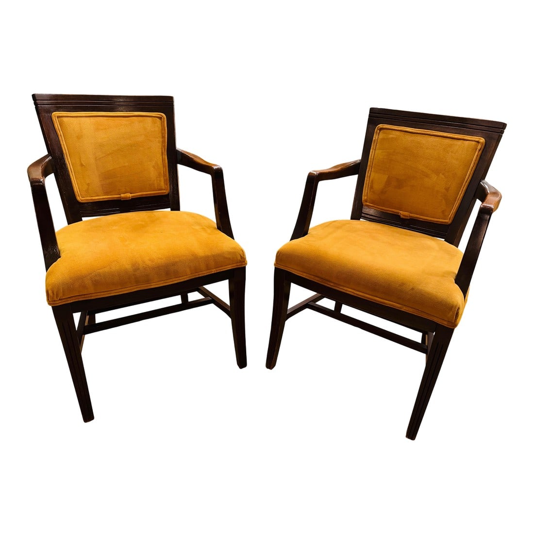 Mid 20th Century Mid-Century Modern Mahogany Upholstered Arm Chairs, a Pair: Gorgeous mid-century mustard upholstered arm chairs in wonderful condition. Sturdy and comfortable, these chairs will add a pop of color that is classic mid-century modern. Mahogany wood is carved and