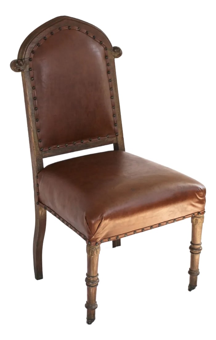 English Leather and Wood Chair From the Mid 1800s: Leather chair with wood base on wheels. Possibly oak. Leather is antique but appears to be a later addition and is secured with brass upholstery tacks on the edges. Very castlecore or medievalcore sty
