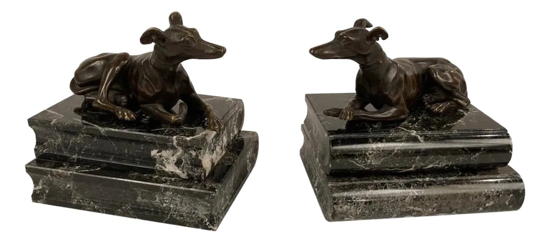Pair of Regency Bronze Figures of Reclining Whippets on Green Marble Bases: Pair of English Regency bronze whippets or greyhounds on verdi antico marble book form bases, after a model by Thomas Weeks. Each dog sculpture is beautifully cast with their individual personalities.