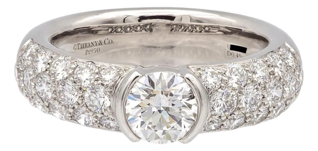 Tiffany & Co. Etoile Platinum 1.26 CTS Total Round Pave Diamond Engagement Ring, Size 4: A discontinued and highly sought-after design from Tiffany & Co.'s iconic Etoile Collection, this platinum ring features a 0.49ct round brilliant center diamond (H color, VS1 clarity) in a sleek parti