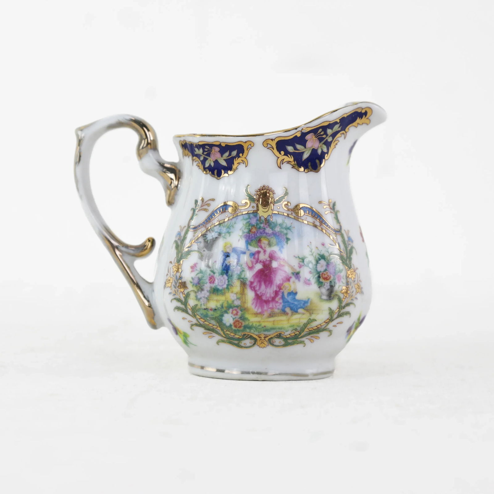 Elegant Victorian Porcelain Creamer With Ornate Blue and Gold Floral Design - 10