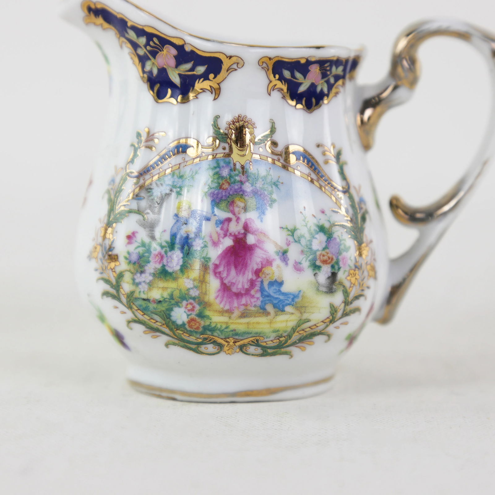 Elegant Victorian Porcelain Creamer With Ornate Blue and Gold Floral Design - 8