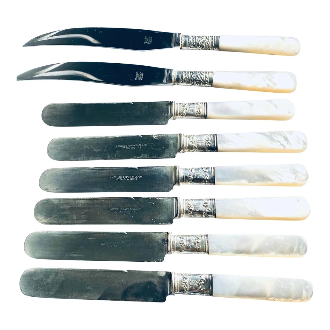 1930s Fruit & Butter Mother-Of-Pearl Handled Knives with Sterling Silver Accents- Set of 8: A Charming Addition to Your Tableware Collection Elevate your dining presentation with this two-part set of knives, each featuring lustrous mother-of-pearl handles and sterling silver accents.