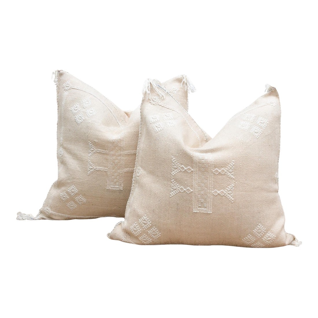Pair of Sahara White Silk Rug Pillows: Introduce a harmonious touch of refined Moroccan artistry to your home with this exquisite pair of handcrafted tribal cactus silk pillows. Woven from the durable and subtly textured fibers of the Saha