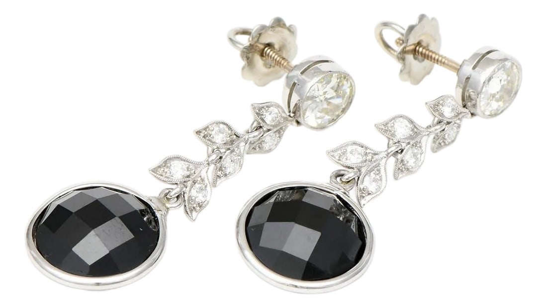 Platinum Spinel(11.51) & Diamond(2.22) Earrings, 2 pieces: Shining in the darkest late-night sky, these black spinel and diamond earrings will make you sparkle like a constellation. You'll gravitate to these earrings like the ocean tides to the moon. Length: