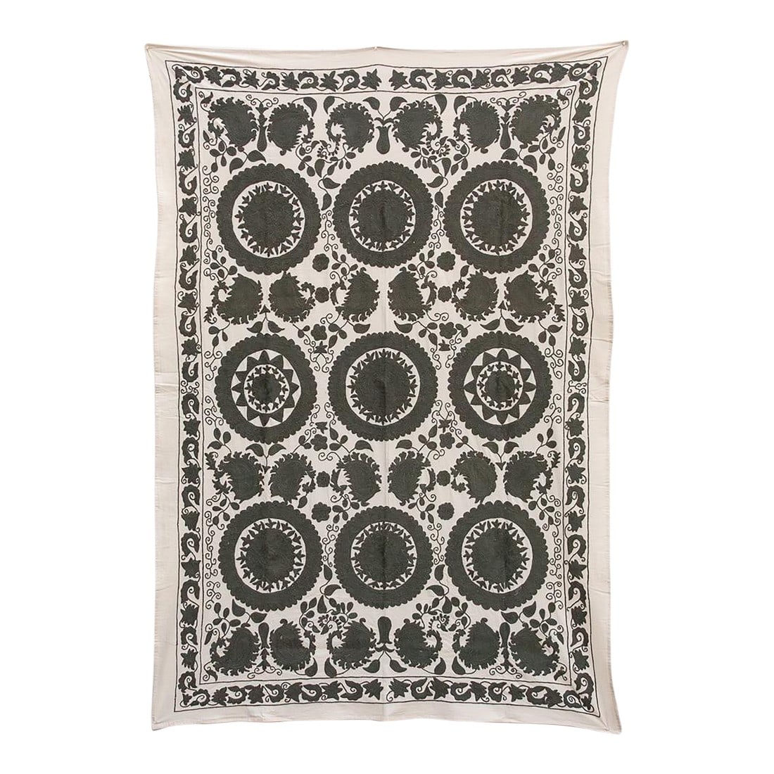Stone Medallion Hand-Embroidered Suzani Throw: This dramatic textile is an authentic Suzani (suzan is Persian for "needle") from Central Asia, likely originating in the Tashkent or Bukhara region of Uzbekistan. This piece is especially prized for