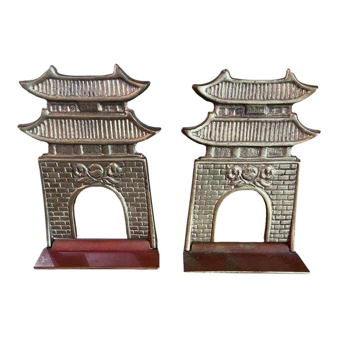 Vintage Brass Pagoda Bookends "” Mid-Century Architectural Accent: Elevate your shelf styling with this striking pair of vintage brass pagoda bookends. Cast in solid brass with architectural detailing, each features a tiered roof silhouette and arched gateway evocati