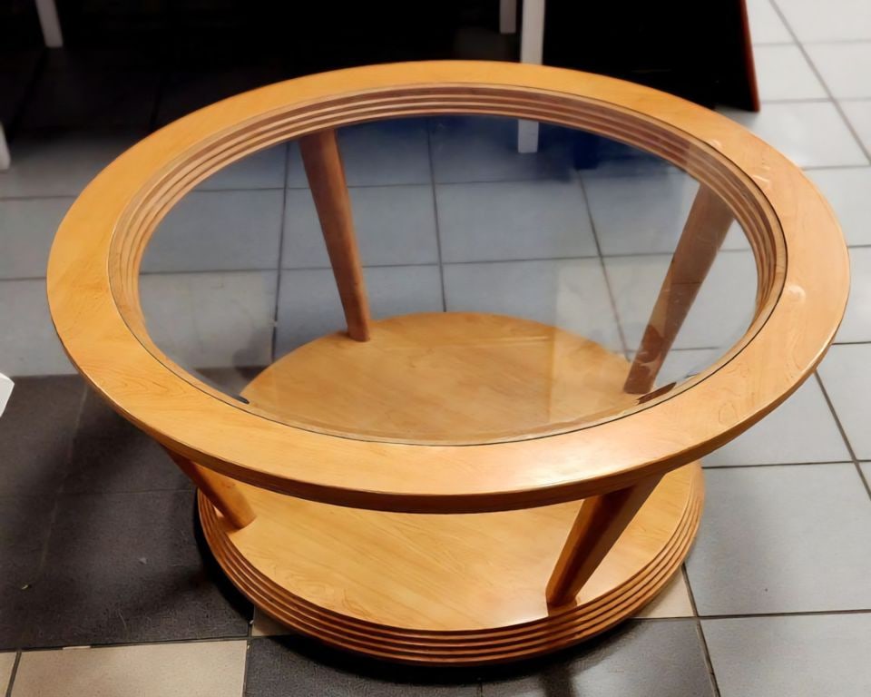 Stylish mid-century modern round coffee table on casters w/ glass top and a lower level.: Stylish mid-century modern round coffee table on casters w/ glass top and a lower level. Shipping: Domestic: Shipping rates are determined by destination International: Foreign shipping rates are dete