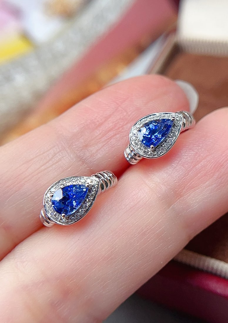 18K Gold Sapphire Ear Clips: Title: 18K Gold Sapphire Ear Clips Description: 18k Gold Sapphire Earrings with Glass Body, Cornflower Blue, Sparkling Brilliance, Distinctive and Textured, Main Stone Approximately 0.9 Carats,