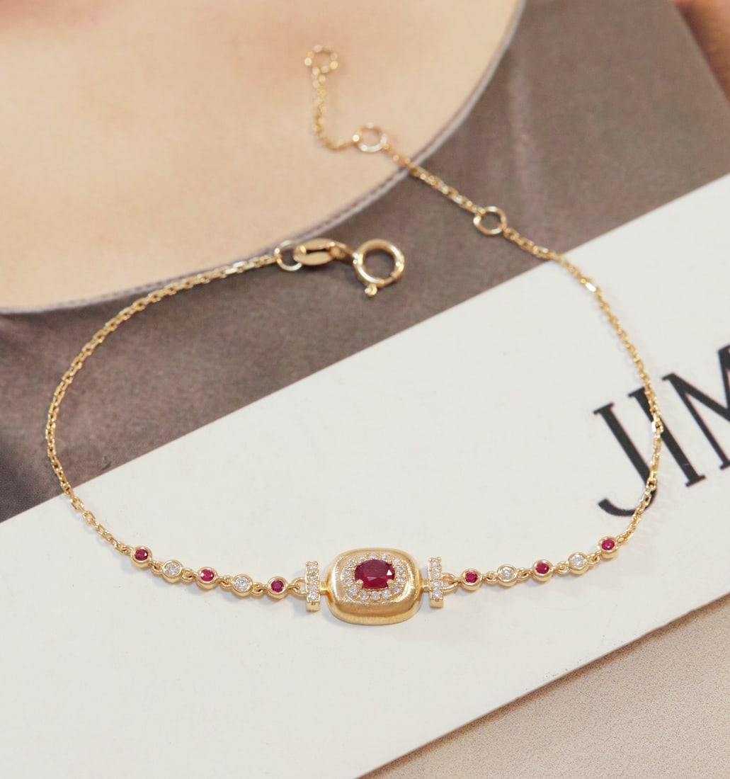 18k gold ruby and diamond bracelet: Title: 18k gold ruby and diamond bracelet Description: 18k gold ruby and diamond bracelet Reserve: $1,100.00 Shipping: Domestic: Shipping rates are determined by destination International: Foreign shi