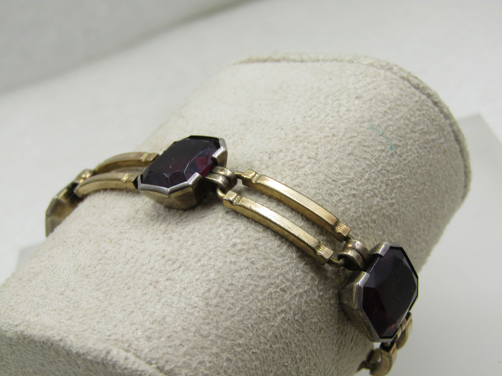 Vintage 1940's Purple Stone Bracelet, 10kt G.F. Signed, 7": Vintage 1940's Purple Stone Bracelet, 10kt G.F. Signed, 7". This is m arked 1/20 10kt gold filled and signed with what is either E B or CB inside a diamond frame. The bracelet has four large purple gl