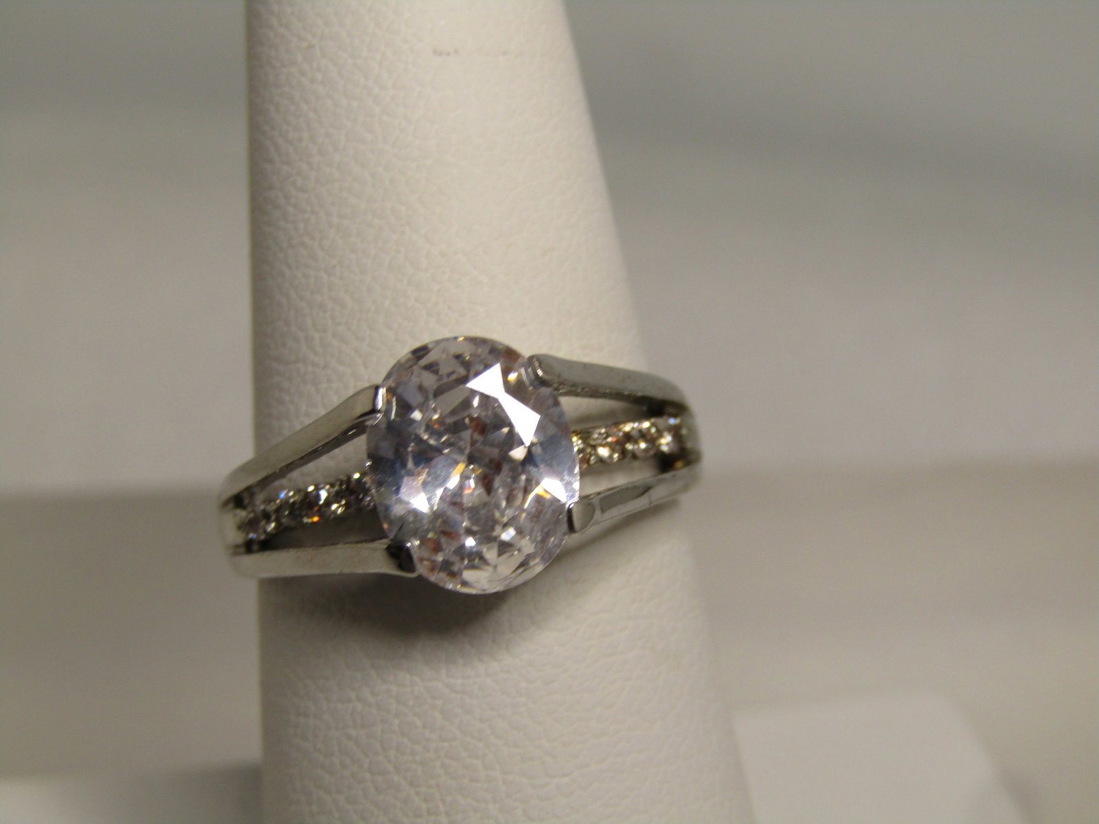 Vintage Amethyst Baguette Stepped Ring, Sz. 8, Avon, 1970's-1980's, Gold Plated: Vintage Amethyst Baguette Stepped Ring, Sz. 8, Avon, 1970's-1980's, Gold Plated. this tests at 10kt and 12kt for being yellow gold filled or plated. It has an appx. 5mm by 3mm purple crystal or glass