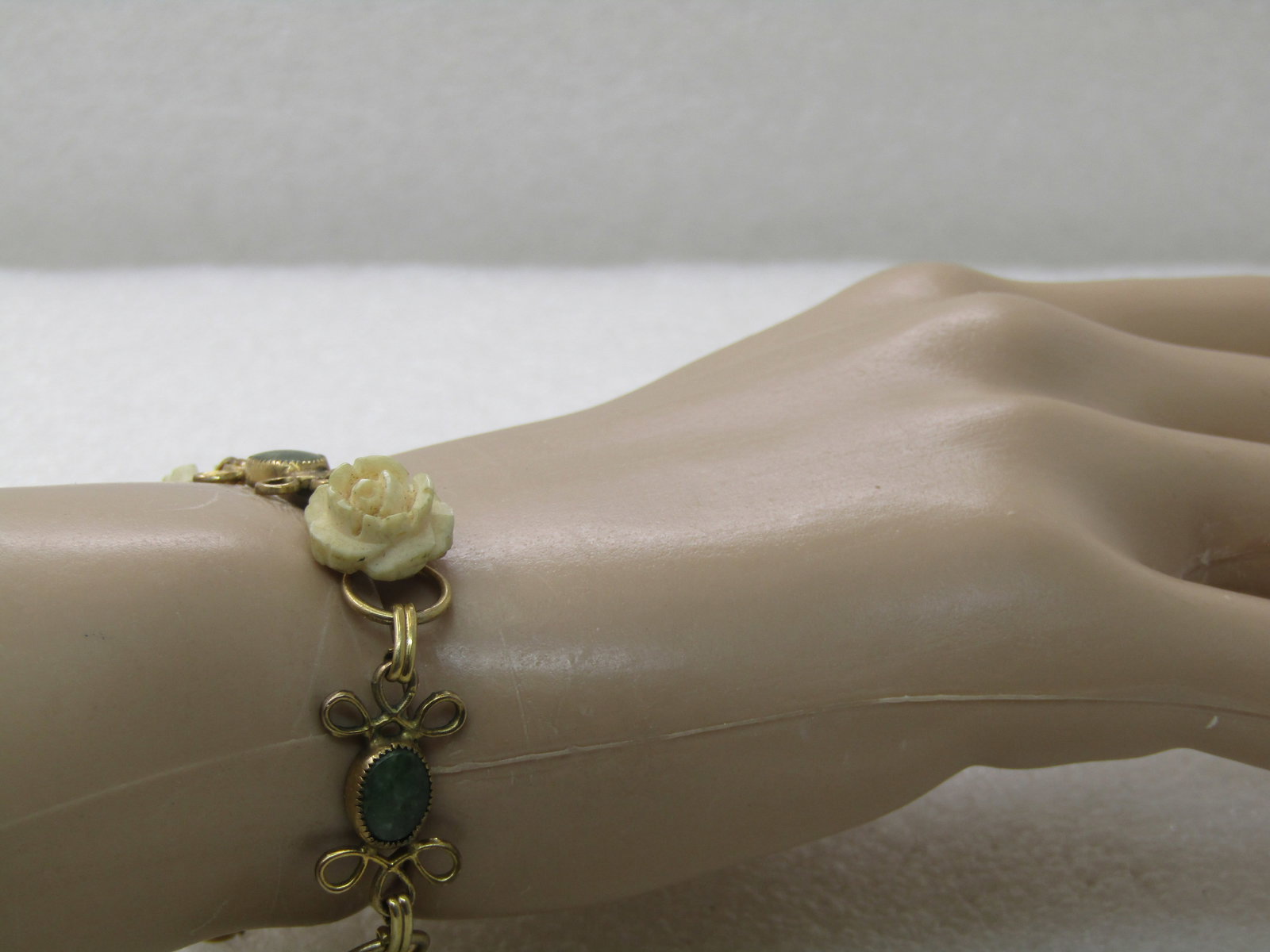 Vintage D'or Faux Carved Rose Bracelet with Green Stones, 7.5" - scrolled accent on each side of the - 6