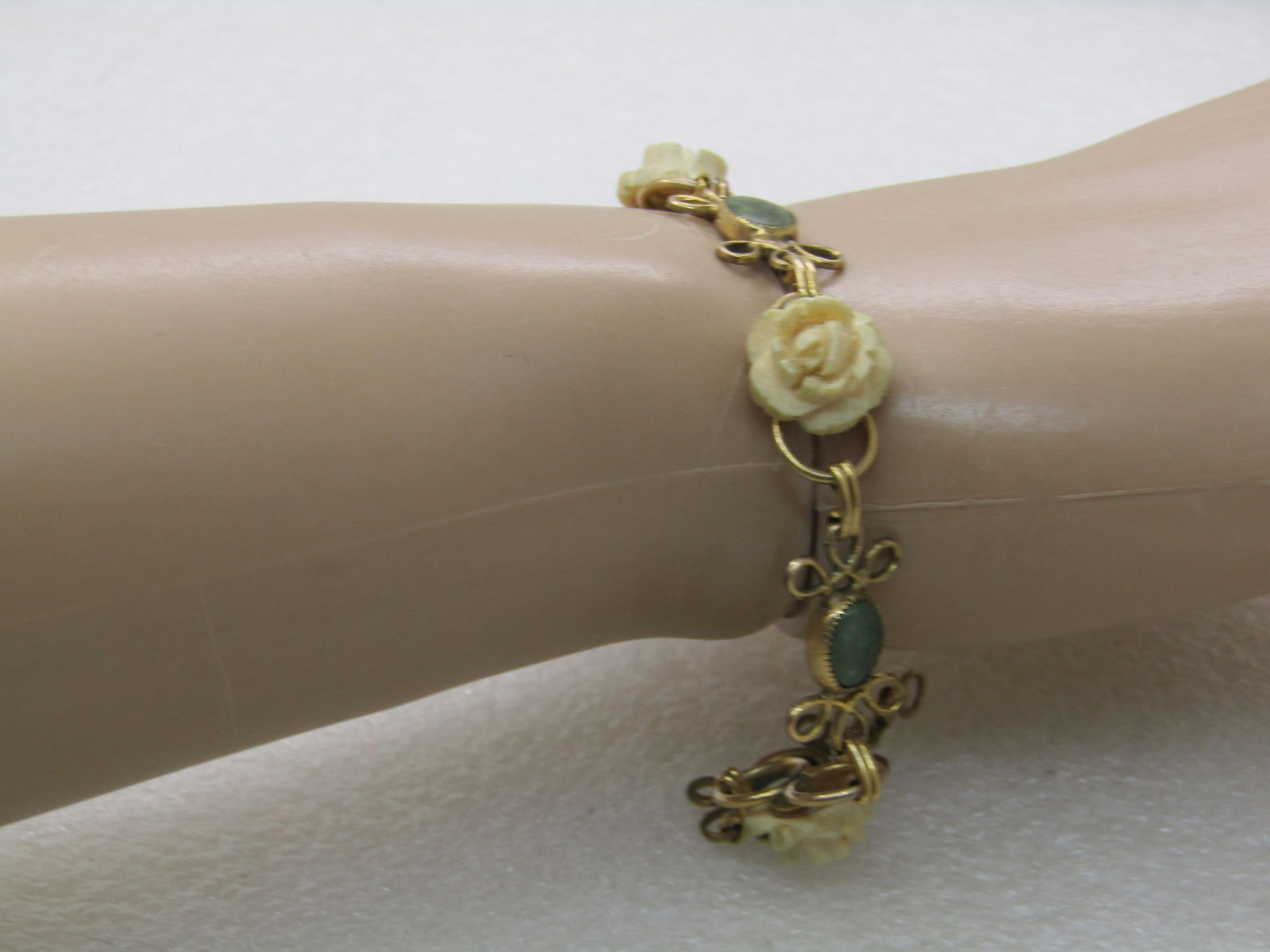Vintage D'or Faux Carved Rose Bracelet with Green Stones, 7.5" - scrolled accent on each side of the - 7