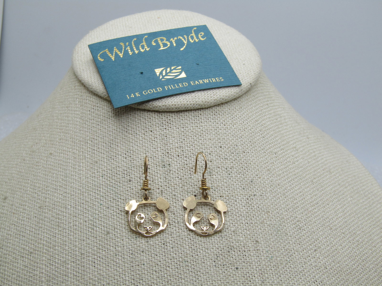 14kt G.F. Wild Bryde Panda Earrings, on Original Card, 1990's: 14kt G.F. Wild Bryde Panda Earrings, on Original Card, 1990's. Cut-out panda bear head dangling earrings on 14kt gold filled earwires. Vintage new stock on original card. They are appx. 1-1/8"