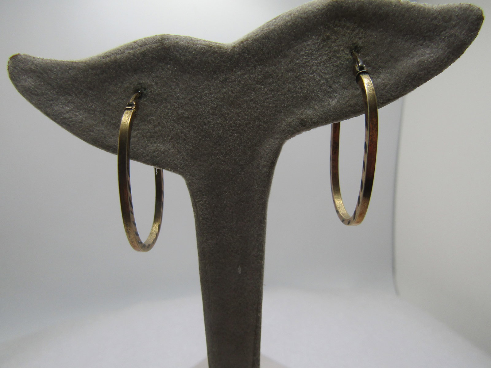 Vintage Sterling Vermeil Hoop Earrings, Pierced, 1970's and After: Vintage Sterling Vermeil Hoop Earrings, Pierced, 1970's and After. Theys are ovals with notched carved accents on the sides. Hinged post. 1.25" tall and 3/4" wide. . They are marked .925 and 1/20 10kt