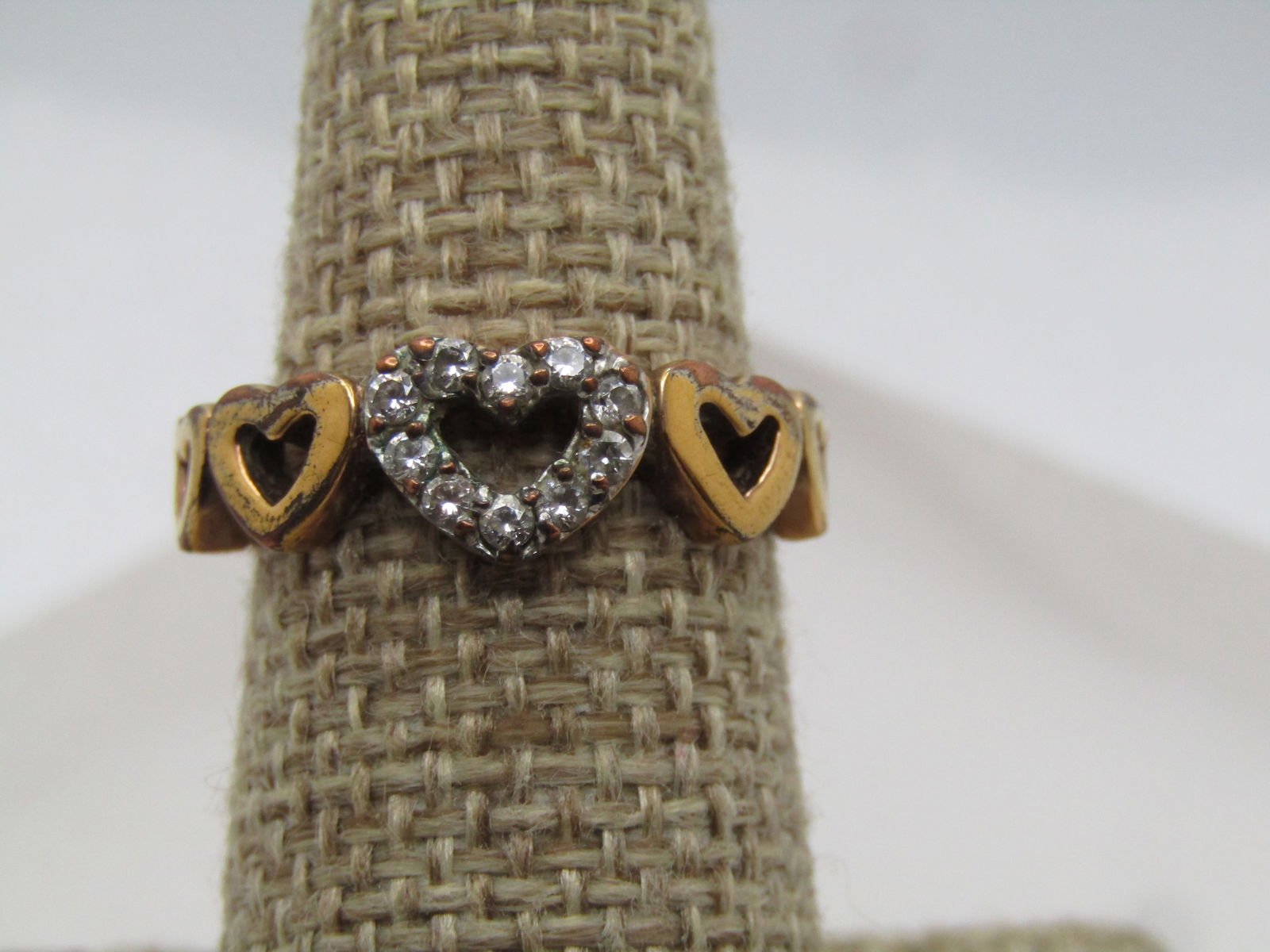 Vintage 10kt G.F. Five Heart Ring with Rhinestones, Sz. 7.5, 1980's, Signed: Vintage 10kt G.F. Five Heart Ring with Rhinestones, Sz. 7.5, 1980's, Signed RSC. T his hs five graduated open hearts over the top of the finger with the center heart having a rhinestone frame, clear
