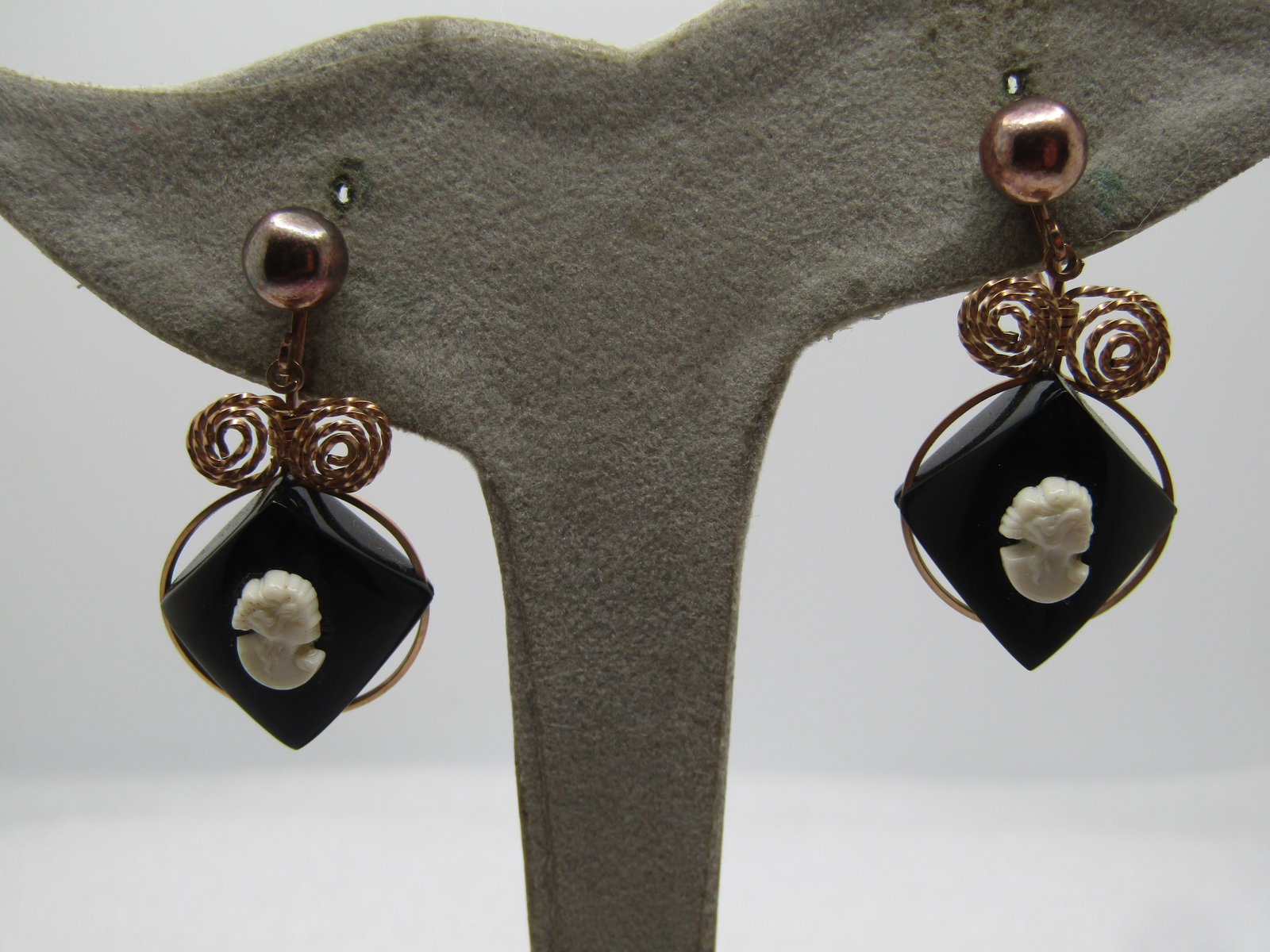 Vintage 10kt G.F. Cameo Earrings, Screwback Drop, 1960's: Vintage 10kt G.F. Cameo Earrings, Screwback Drop, 1960's. Black and white curved square black acrylic bases that are set on their points and tapered in thickness with a white cameo bust on top. They a