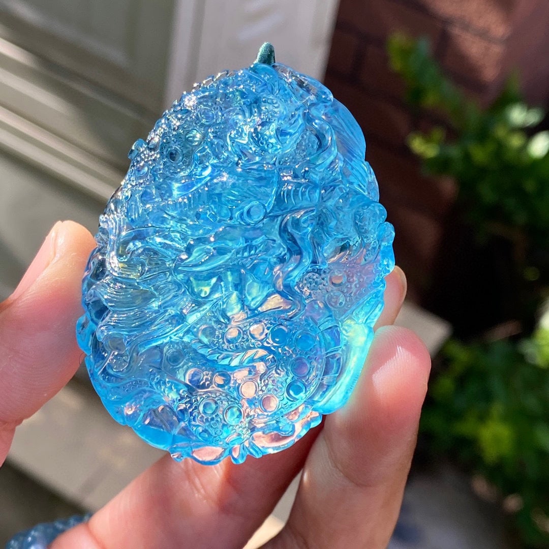 Hand-carved Natural Aquamarine Dragon Pendant with Certificate: Title: Hand-carved Natural Aquamarine Dragon Pendant with Certificate Origin: Chinese Date/Period: After2020 Materials: Aquamarine Dimensions: 61x47x18(mm) 2.40x1.85x0.71(inches) Weight 0.14