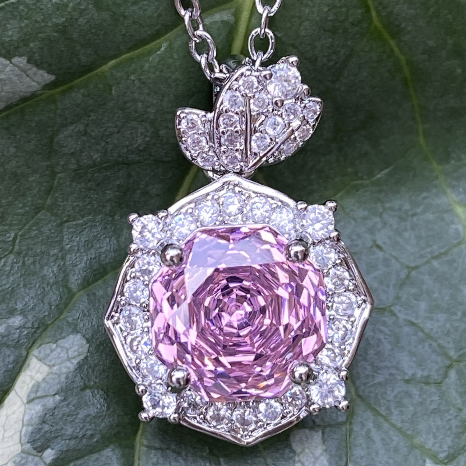 18K White Gold Plated Radiant-Cut Pink Sapphire and Moissanite Halo Pendant Necklace: Title:18K White Gold Plated Radiant-Cut Pink Sapphire and Moissanite Halo Pendant NecklaceDescription:An elegant radiant-cut Pink sapphire pendant necklace, beautifully surrounded by a halo of