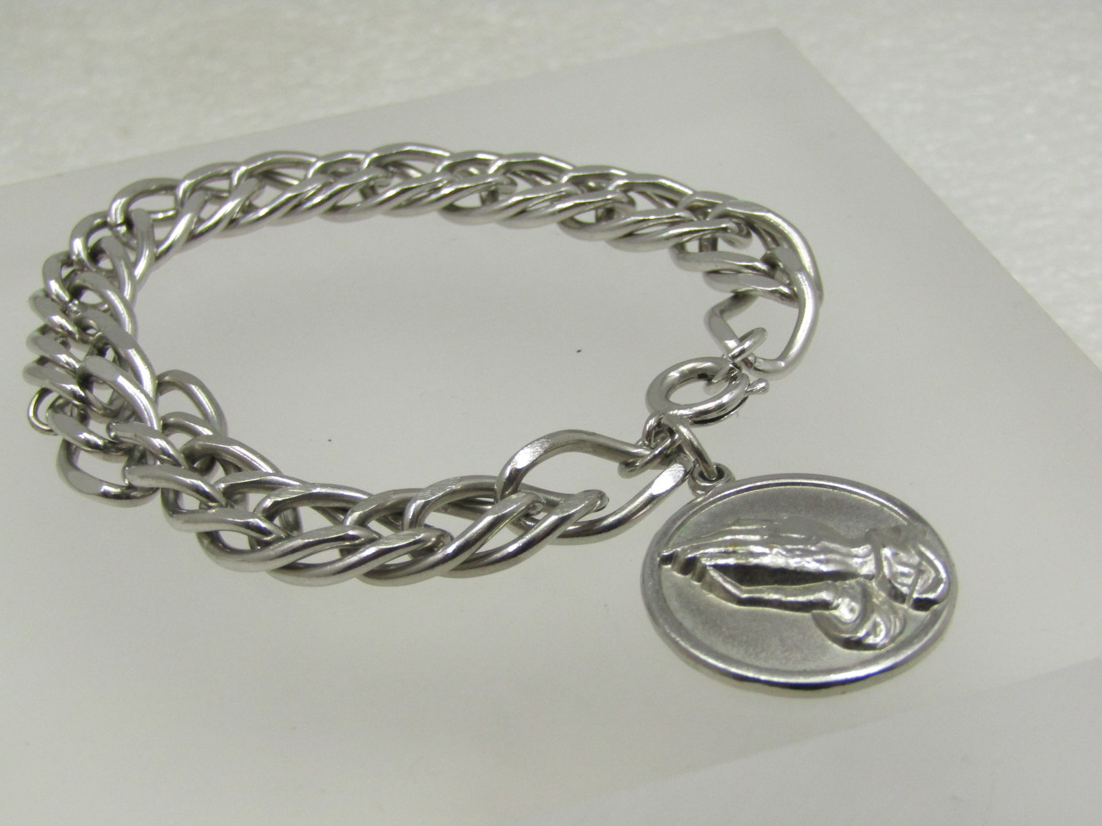 Vintage Serenity Prayer Charm Bracelet, 9.5mm, 7.25": Vintage Serenity Prayer Charm Bracelet, 9.5mm, 7.25". This has a double chunky link design with a praying hands charm on the clasp end and on the back is the Serenity Prayer. This is not sterling