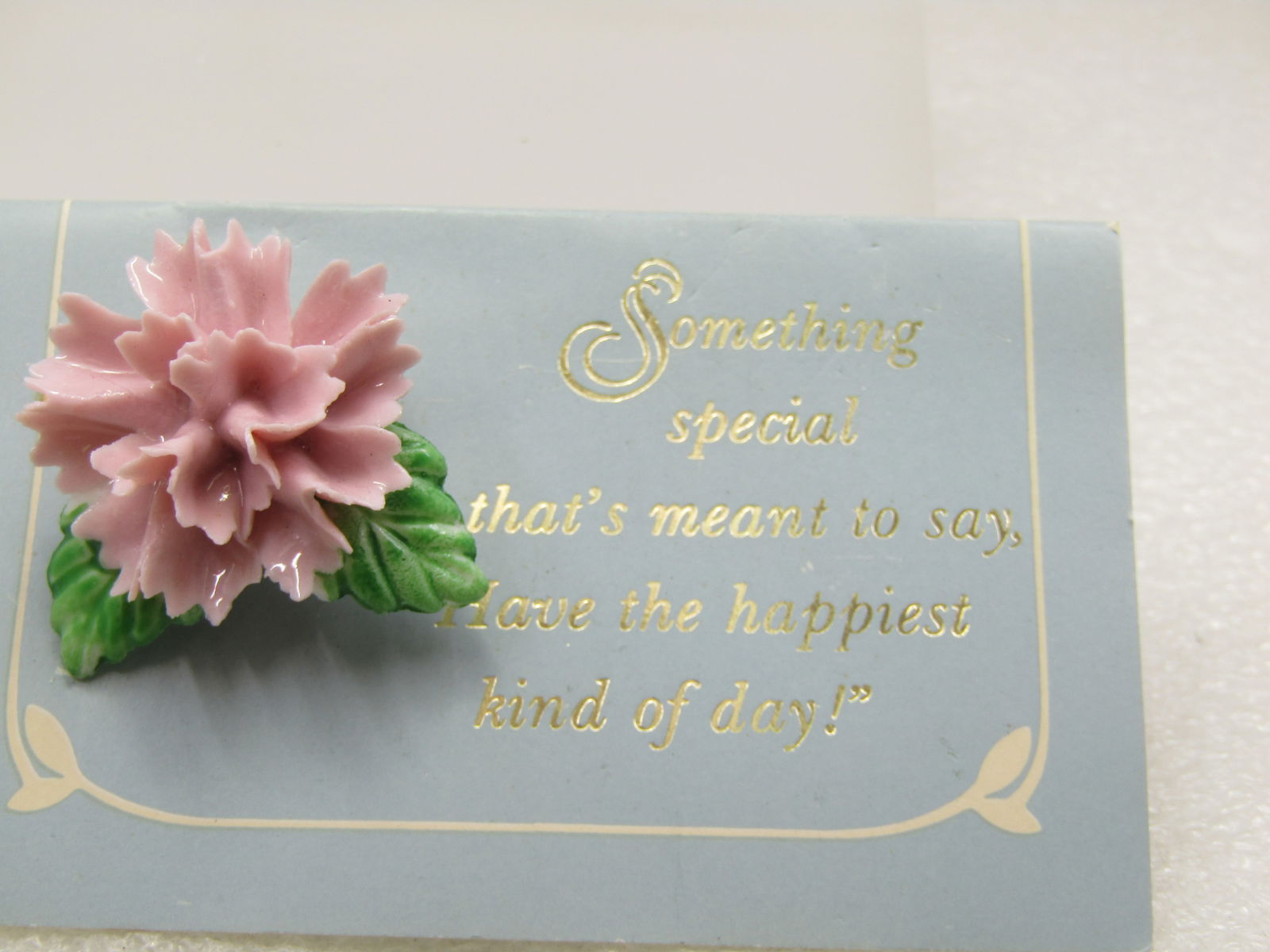 Vintage Pink Carnation Brooch, On Card, 1980's: Vintage Pink Carnation Brooch, On Card, 1980's, 1.25" with two green leaves. It is on a card that states 'Something special that's meant to say, have the happiest kind of day!" The card is makred