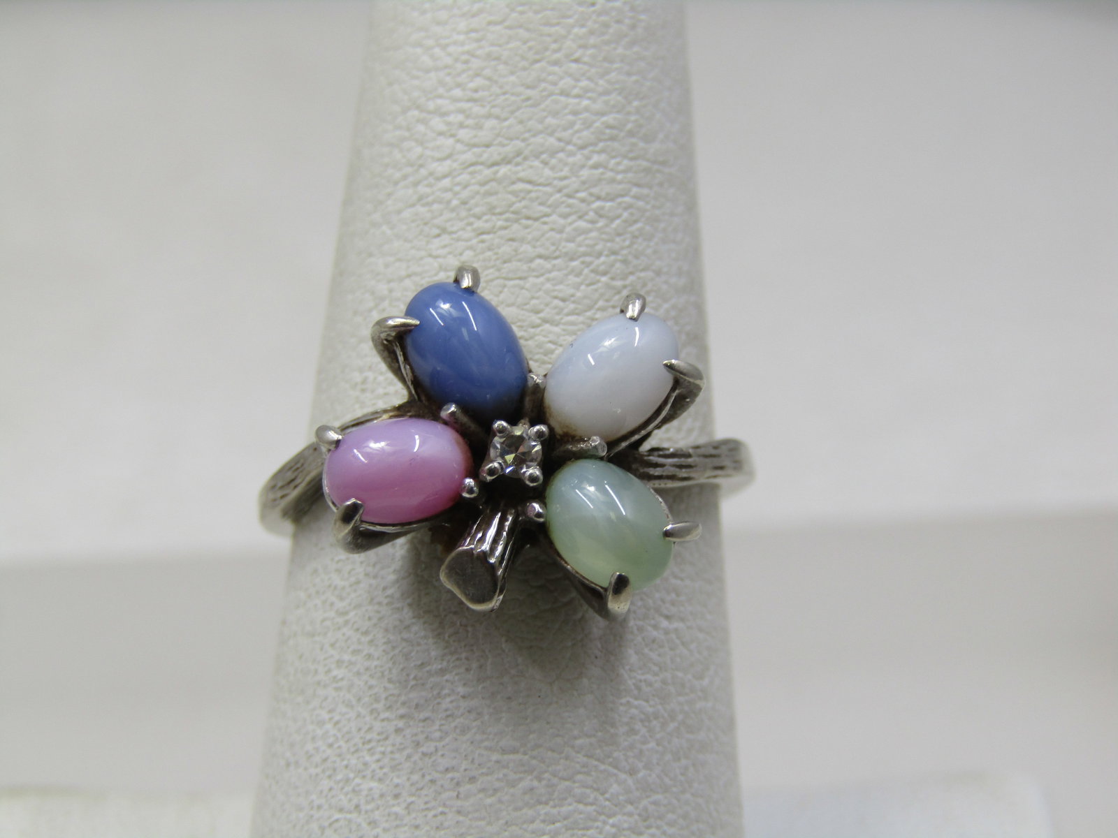 Vintage 10kt Star Sapphire Diamond Shamrock Ring, Sz. 7.25, Signed: Vintage 10kt Star Sapphire Diamond Shamrock Ring, Sz. 7.25, Signed BT-10K. It tests as 10kt with a weight of appx. 3.72 gr. It has a pear-shaped star sapphire as each of the petals - green, pink, blue