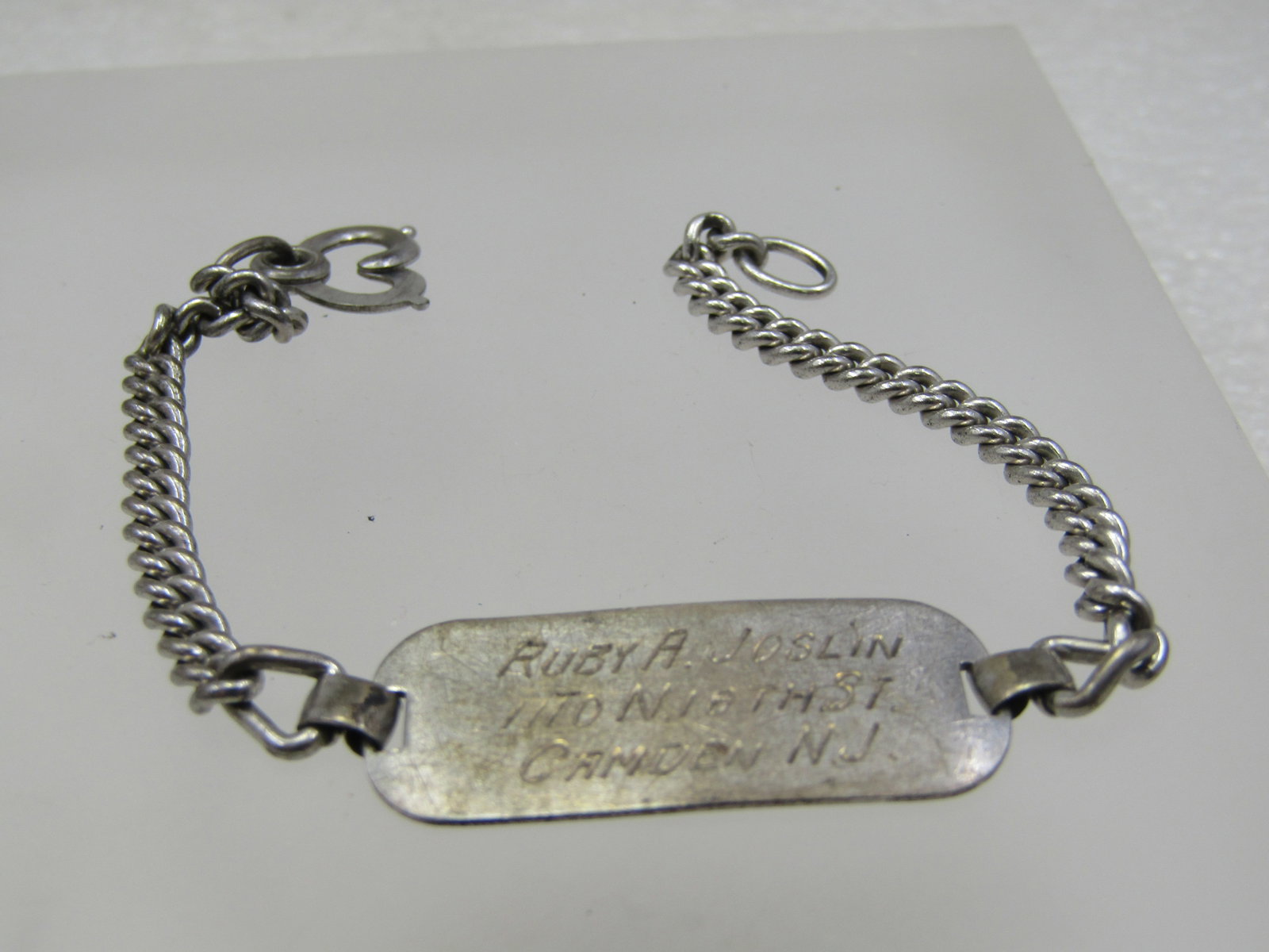 Vintage Sterling I.D. Bracelet Signed FCC. 7" 1940's-1950's: Vintage Sterling I.D. Bracelet Signed FCC. 7" 1940's-1950's. This is engraved with a woman's name and address.Weight is appx. 9.29 gr. It has been tested. The chain is a narly 4mm wide curb link