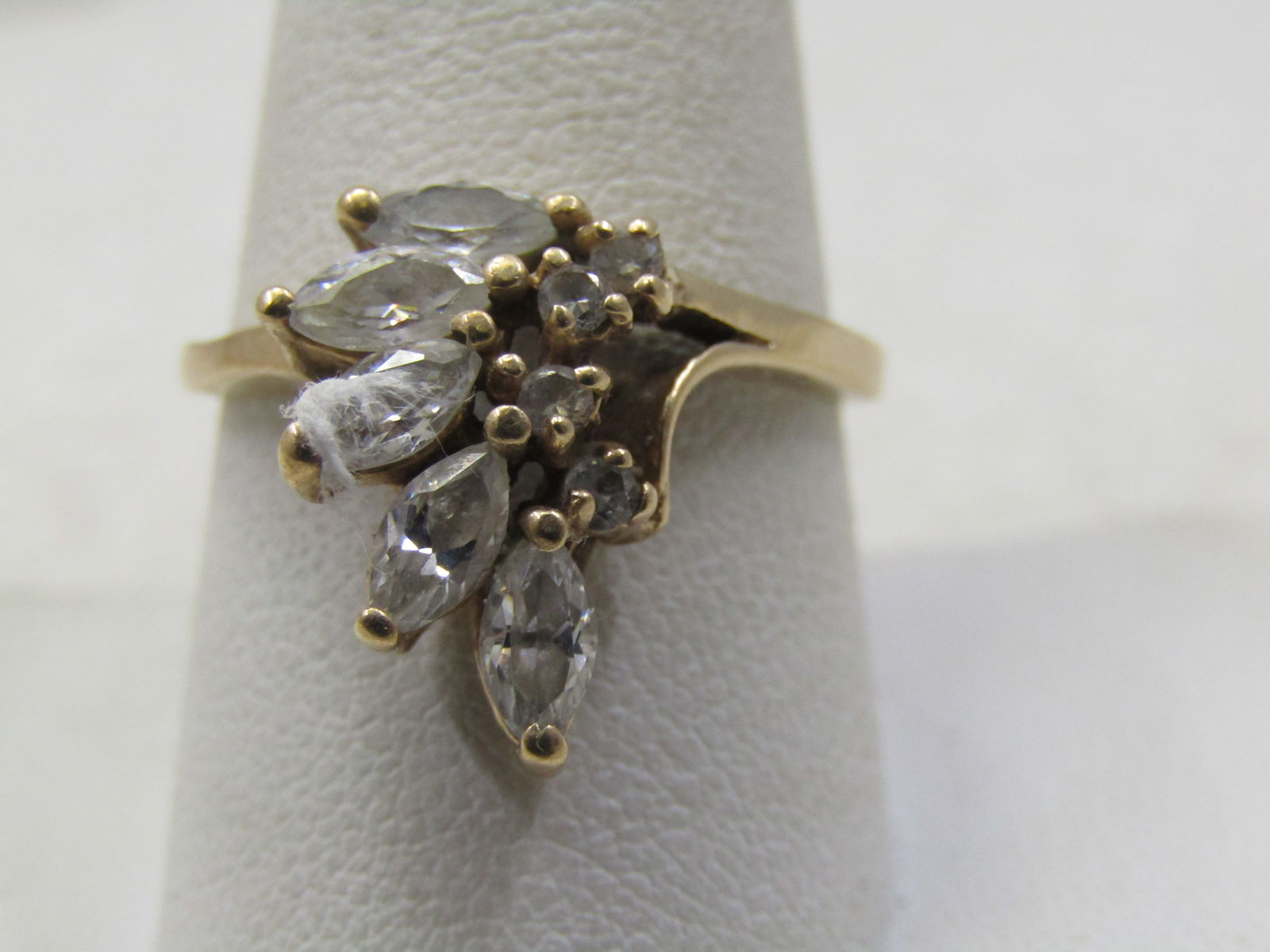 Vintage 10kt CZ Cocktail/Engagement Ring, Sz. 10, Signed FtJ & LIND: Vintage 10kt CZ Waterfall Cocktail/Engagement Ring, Sz. 10, Signed FtJ & LIND. This has five marquise czs and four round stones on he inside points of the marquise stones. The marquise cz stones