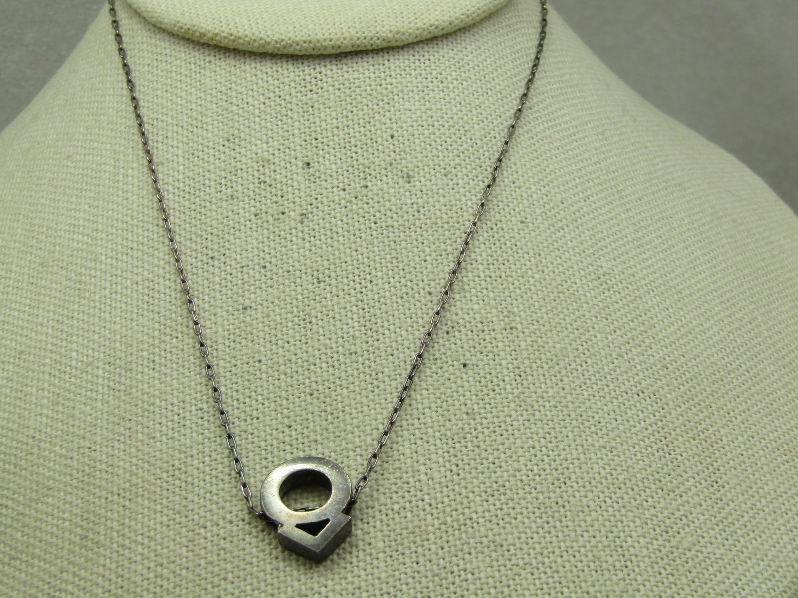 Vintage Circle Arrow Up Necklace 15.25", Mid-Century: Vintage Circle Arrow Up Necklace 15.25", Mid-Century. Sterling is marked on both the back of the pendant that the 1mm wide chain slides through and on the chain itself which is an elongated oval