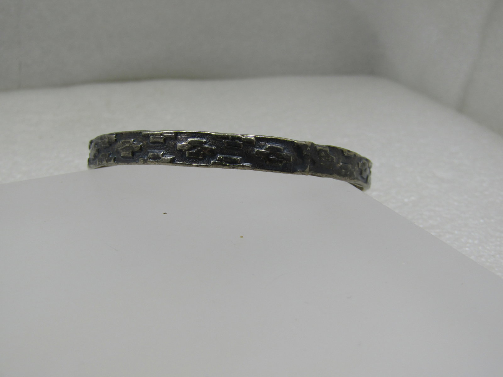 Vintage Mexico Bangle Bracelet, Brick Design, 8", Signed: Vintage Mexico Bangle Bracelet, Brick Design, 8", Signed Mexico. It has an opening of appx. 2.75" and will fit larger wrists. It has a repousse design of what looks like a pueblo wall with raised