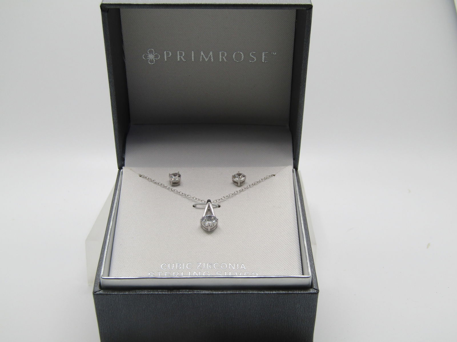 Sterling CZ Necklace and Pierced Earring Set in Box, Primrose: Sterling CZ Necklace and Pierced Earring Set in Box, Primrose. Vintage New in Box, Gift Quality. Originally sold this at $60.00. In quality hinged box with th name Primrose inside the lid. The