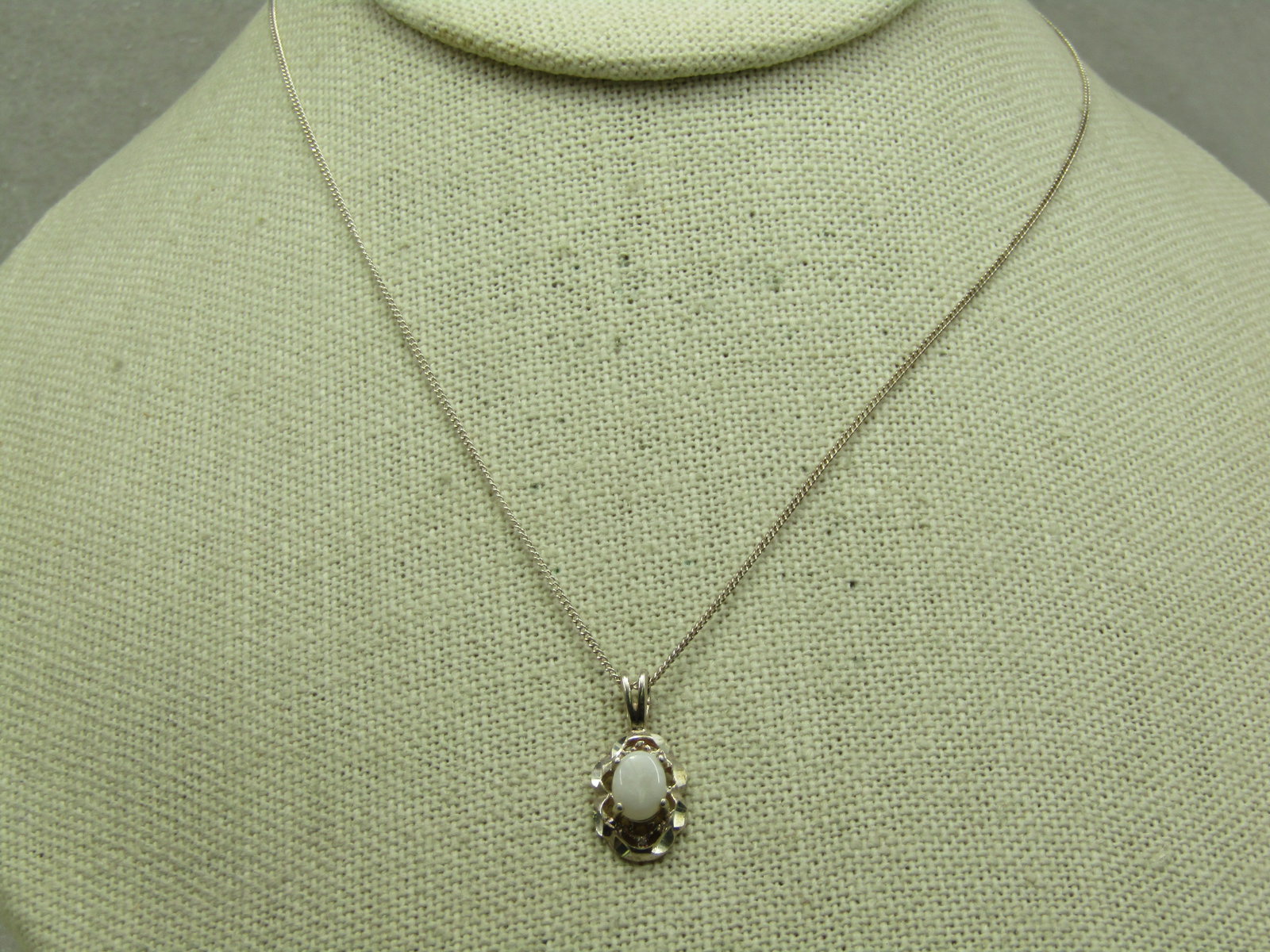 Vintage Sterling White Stone Necklace, Signed Avon, 19": Vintage Sterling White Stone Necklace, Signed Avon, 19". The chain is a .8mm sterling chain with spring clasp. Marked sterling and signed Avon. Tested, weight is appx. 2.39 gr.The pendant is 3/4"