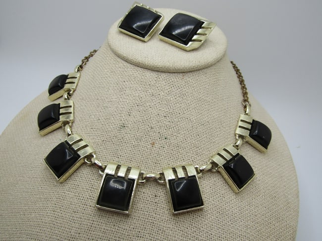 Vintage Black Glass Necklace & Earrings Set, 1950's-1960's: Vintage Black Glass Stone Necklace/Earrings Set, 1950's-1960's. Gold tone mod abstract deisgn with an offset square with an angle frame on the front and left sides with a ride design with open areas -