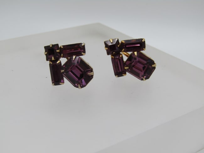 Vintage Amethyst Rhinestone Earrings, Screwback, 1940's-1960's: DescriptionVintage Amethyst Rhinestone Earrings, Screwback, 1940's-1960's. There is a 12mm by 10mm rectangular princess cut main stone with a 4.5mm square stone over top and a 9mm by 4mm baguette comi