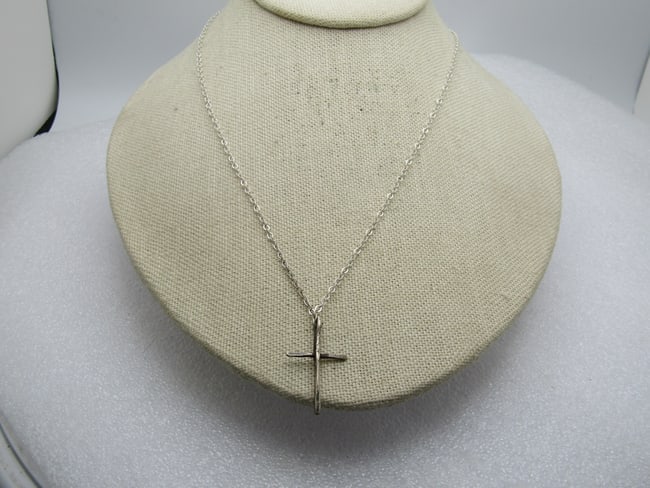 Vintage Sterling Cross Necklace, 19" Silver Tone Chain. 1980's: Vintage Sterling Cross Necklace, 19" Silver Tone Chain. 1970's-1980's. The cross has a hammered look and is appx. 1-1/8" tall and 3/4" wide. The bail is built into the cross. It tests as sterling with